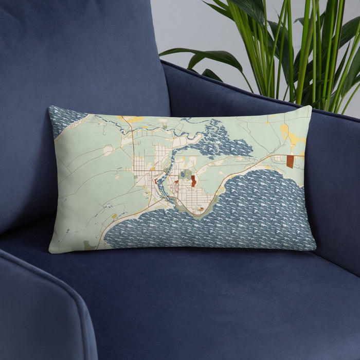 Custom Manistique Michigan Map Throw Pillow in Woodblock on Blue Colored Chair