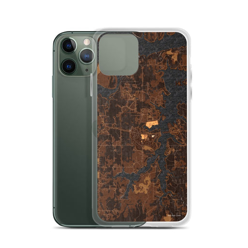 Custom Mannford Oklahoma Map Phone Case in Ember on Table with Laptop and Plant