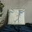 Custom Mannford Oklahoma Map Throw Pillow in Woodblock on Bedding Against Wall