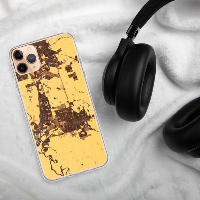 Custom Manteca California Map Phone Case in Ember on Table with Black Headphones