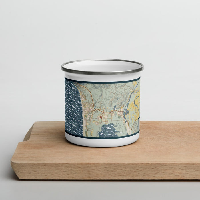 Front View Custom Manzanita Oregon Map Enamel Mug in Woodblock on Cutting Board