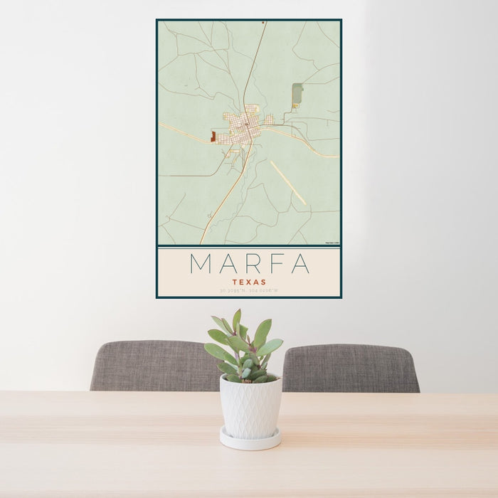 24x36 Marfa Texas Map Print Portrait Orientation in Woodblock Style Behind 2 Chairs Table and Potted Plant