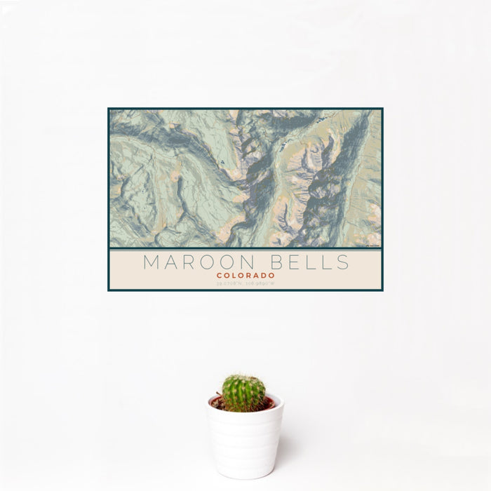 12x18 Maroon Bells Colorado Map Print Landscape Orientation in Woodblock Style With Small Cactus Plant in White Planter