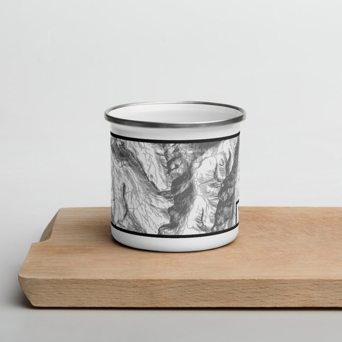 Front View Custom Maroon Bells Colorado Map Enamel Mug in Classic on Cutting Board