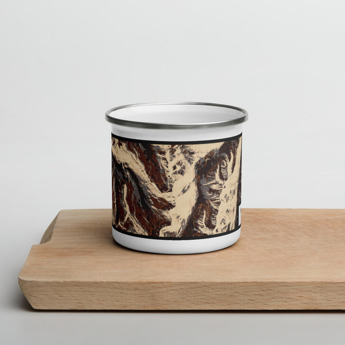 Front View Custom Maroon Bells Colorado Map Enamel Mug in Ember on Cutting Board