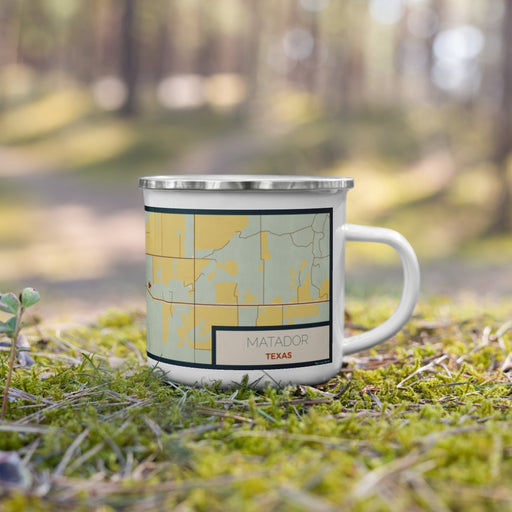 Right View Custom Matador Texas Map Enamel Mug in Woodblock on Grass With Trees in Background