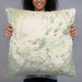 Person holding 22x22 Custom Mauna Kea Hawaii Map Throw Pillow in Woodblock