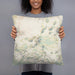 Person holding 18x18 Custom Mauna Kea Hawaii Map Throw Pillow in Woodblock