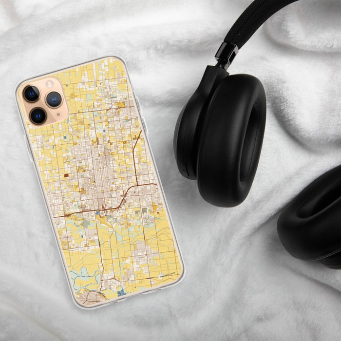 Custom McAllen Texas Map Phone Case in Woodblock on Table with Black Headphones