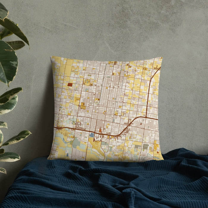 Custom McAllen Texas Map Throw Pillow in Woodblock on Bedding Against Wall