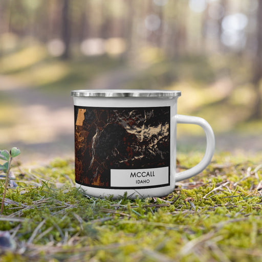 Right View Custom McCall Idaho Map Enamel Mug in Ember on Grass With Trees in Background