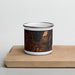 Front View Custom McCall Idaho Map Enamel Mug in Ember on Cutting Board
