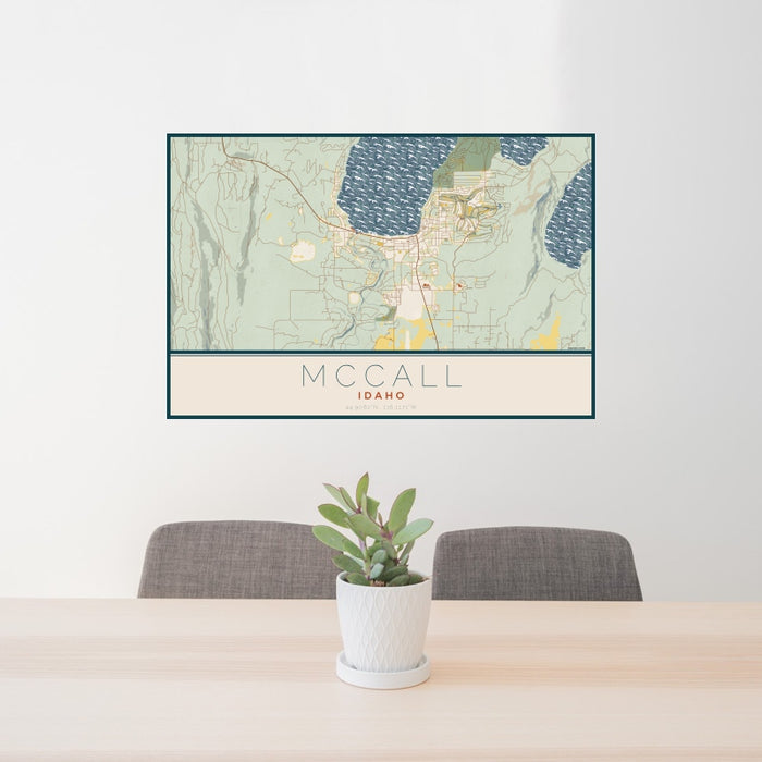 24x36 McCall Idaho Map Print Landscape Orientation in Woodblock Style Behind 2 Chairs Table and Potted Plant