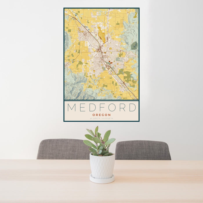 24x36 Medford Oregon Map Print Portrait Orientation in Woodblock Style Behind 2 Chairs Table and Potted Plant