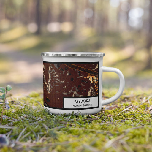 Right View Custom Medora North Dakota Map Enamel Mug in Ember on Grass With Trees in Background