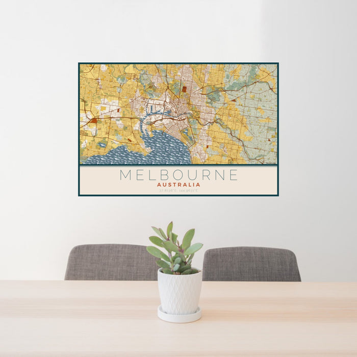 24x36 Melbourne Australia Map Print Lanscape Orientation in Woodblock Style Behind 2 Chairs Table and Potted Plant