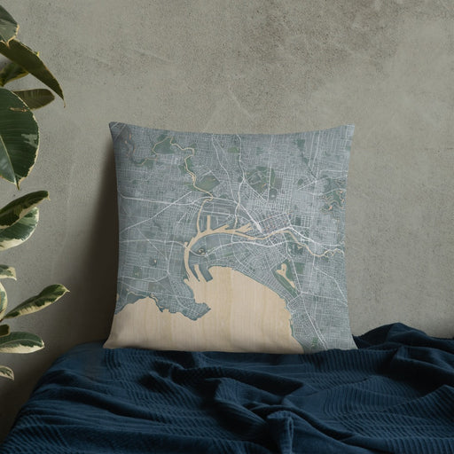 Custom Melbourne Australia Map Throw Pillow in Afternoon on Bedding Against Wall