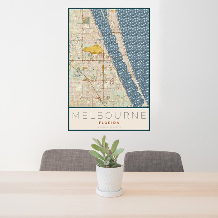 24x36 Melbourne Florida Map Print Portrait Orientation in Woodblock Style Behind 2 Chairs Table and Potted Plant