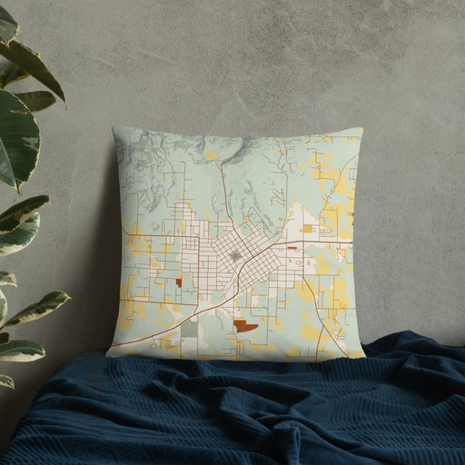 Custom Mena Arkansas Map Throw Pillow in Woodblock on Bedding Against Wall