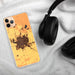 Custom Merced California Map Phone Case in Ember on Table with Black Headphones