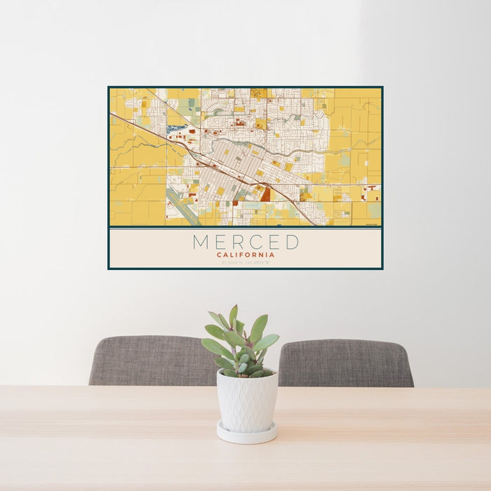24x36 Merced California Map Print Landscape Orientation in Woodblock Style Behind 2 Chairs Table and Potted Plant
