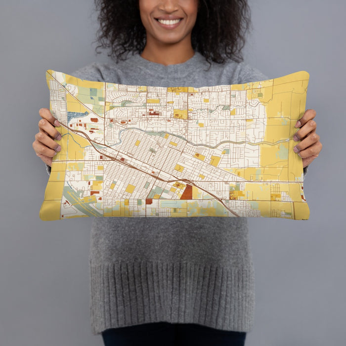 Person holding 20x12 Custom Merced California Map Throw Pillow in Woodblock