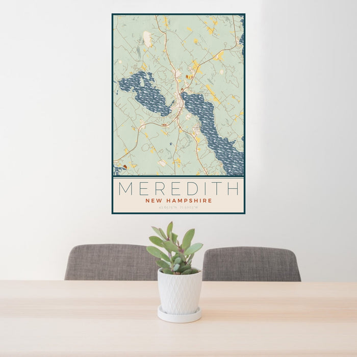 24x36 Meredith New Hampshire Map Print Portrait Orientation in Woodblock Style Behind 2 Chairs Table and Potted Plant