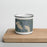 Front View Custom Meredith New Hampshire Map Enamel Mug in Afternoon on Cutting Board