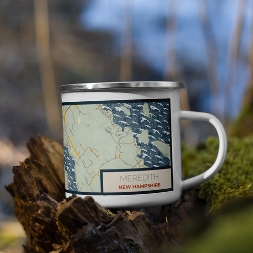 Right View Custom Meredith New Hampshire Map Enamel Mug in Woodblock on Grass With Trees in Background