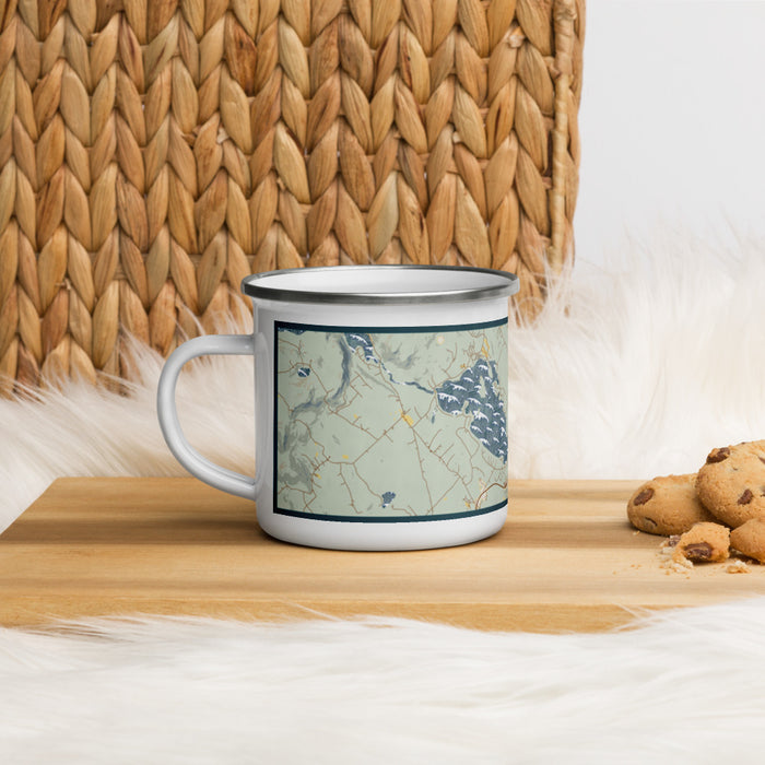 Left View Custom Meredith New Hampshire Map Enamel Mug in Woodblock on Table Top