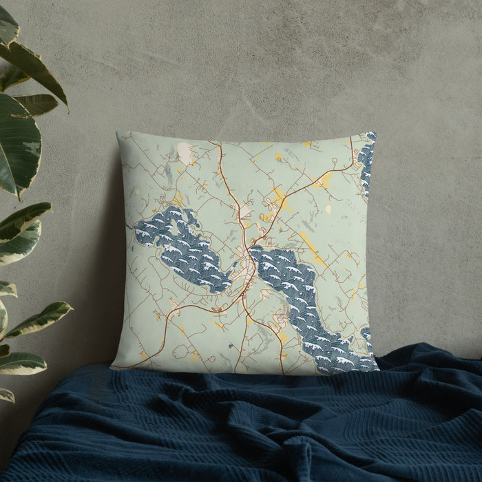 Custom Meredith New Hampshire Map Throw Pillow in Woodblock on Bedding Against Wall