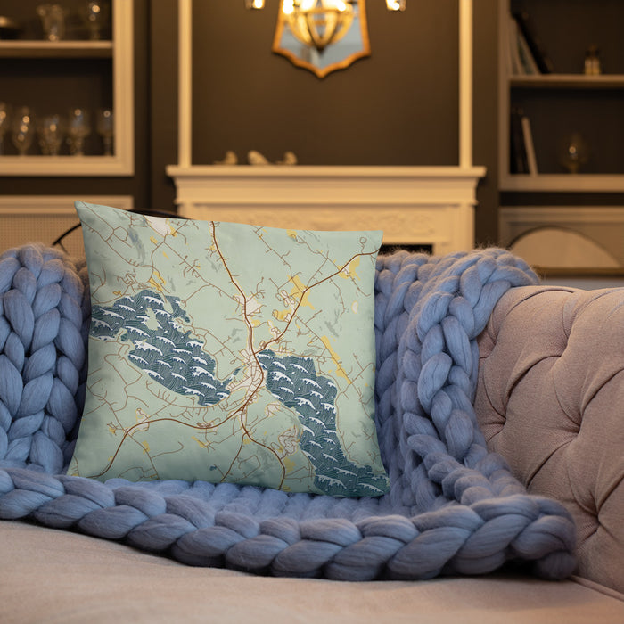 Custom Meredith New Hampshire Map Throw Pillow in Woodblock on Cream Colored Couch