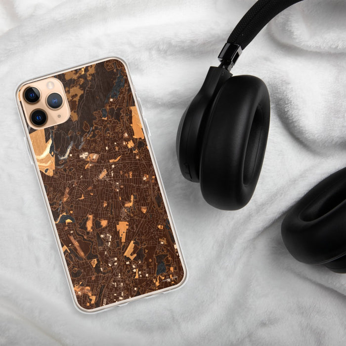 Custom Meriden Connecticut Map Phone Case in Ember on Table with Black Headphones