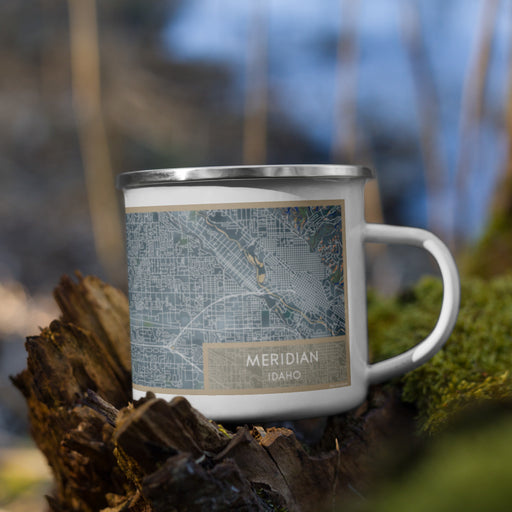 Right View Custom Meridian Idaho Map Enamel Mug in Afternoon on Grass With Trees in Background