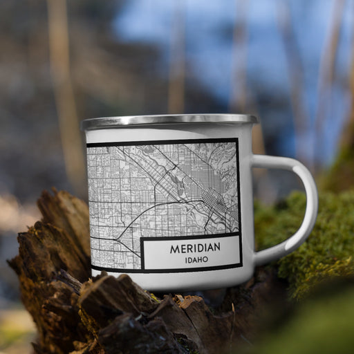 Right View Custom Meridian Idaho Map Enamel Mug in Classic on Grass With Trees in Background