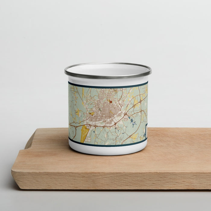 Front View Custom Meridian Mississippi Map Enamel Mug in Woodblock on Cutting Board