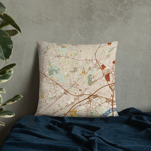 Custom Metuchen New Jersey Map Throw Pillow in Woodblock on Bedding Against Wall