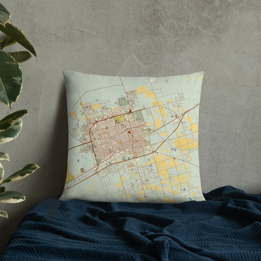 Custom Midland Texas Map Throw Pillow in Woodblock on Bedding Against Wall