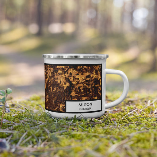 Right View Custom Milton Georgia Map Enamel Mug in Ember on Grass With Trees in Background