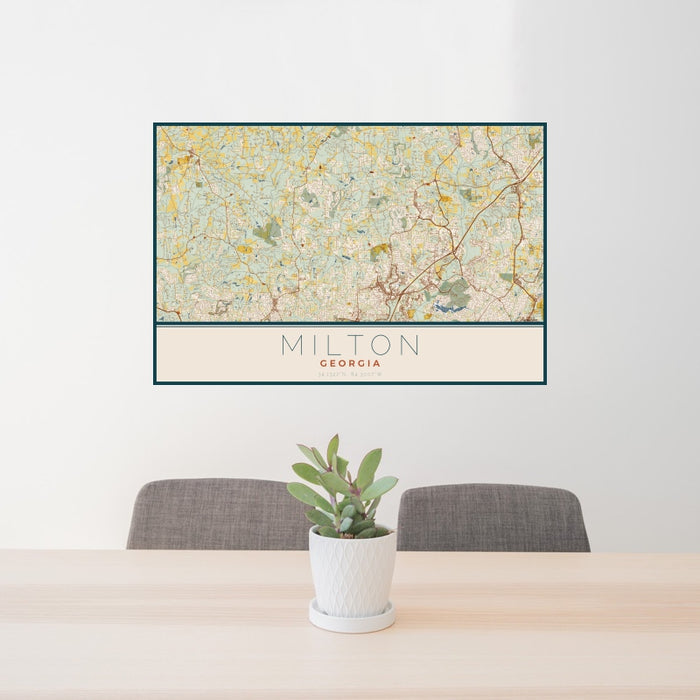 24x36 Milton Georgia Map Print Landscape Orientation in Woodblock Style Behind 2 Chairs Table and Potted Plant