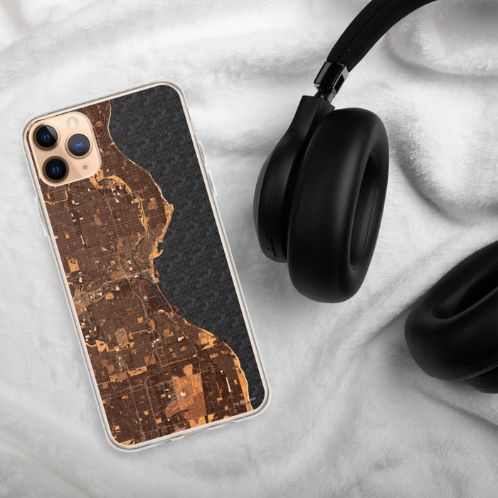 Custom Milwaukee Wisconsin Map Phone Case in Ember on Table with Black Headphones