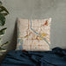 Custom Minneapolis Minnesota Map Throw Pillow in Woodblock on Bedding Against Wall