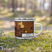 Right View Custom Minot North Dakota Map Enamel Mug in Ember on Grass With Trees in Background