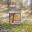 Right View Custom Mission Viejo California Map Enamel Mug in Ember on Grass With Trees in Background
