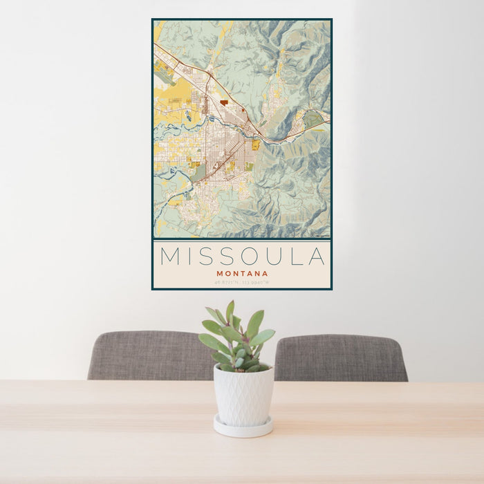 24x36 Missoula Montana Map Print Portrait Orientation in Woodblock Style Behind 2 Chairs Table and Potted Plant