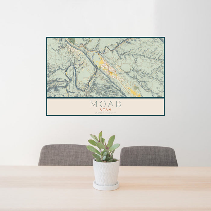 24x36 Moab Utah Map Print Landscape Orientation in Woodblock Style Behind 2 Chairs Table and Potted Plant