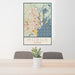 24x36 Mobile Alabama Map Print Portrait Orientation in Woodblock Style Behind 2 Chairs Table and Potted Plant