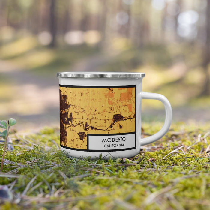 Right View Custom Modesto California Map Enamel Mug in Ember on Grass With Trees in Background