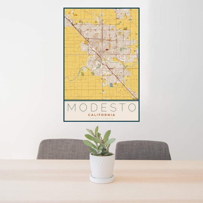 24x36 Modesto California Map Print Portrait Orientation in Woodblock Style Behind 2 Chairs Table and Potted Plant