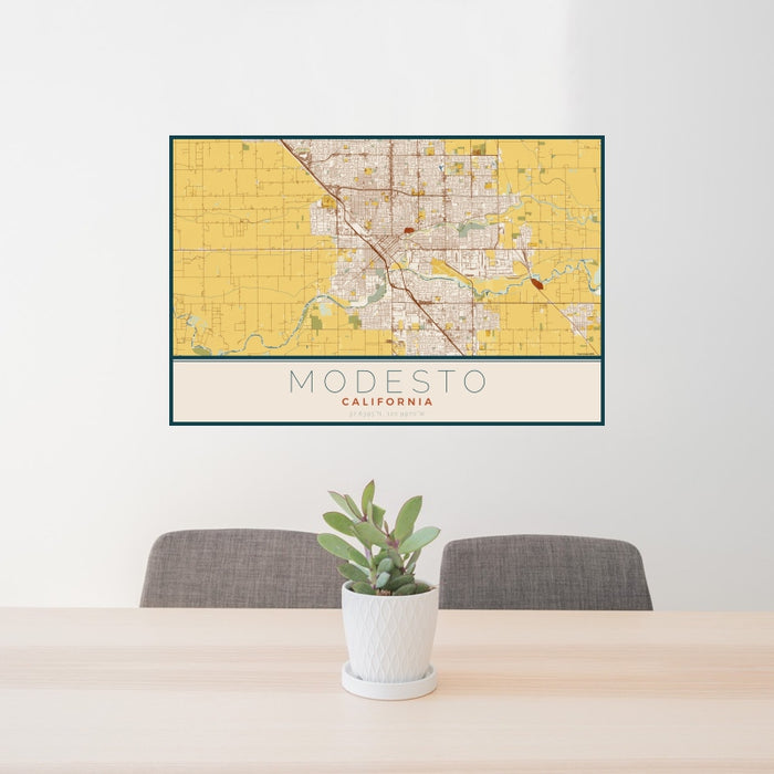 24x36 Modesto California Map Print Landscape Orientation in Woodblock Style Behind 2 Chairs Table and Potted Plant